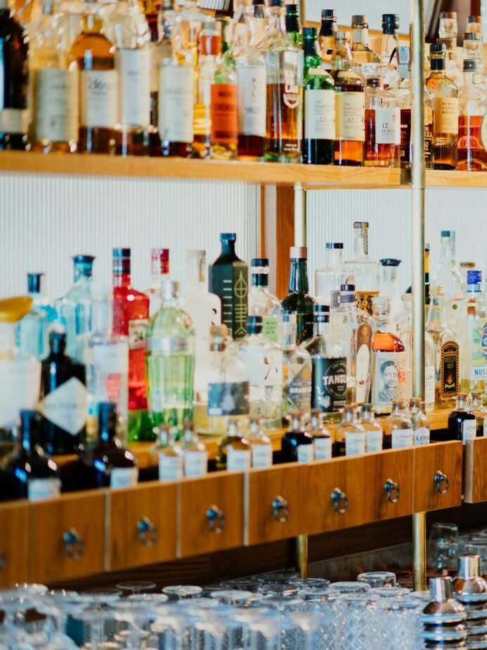 Bar Supervisor Job Description: Free Template, Duties & Hiring Test 1 Beverage bottles arranged on a bar shelf