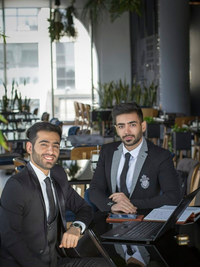 Two professionals discussing information in a meeting