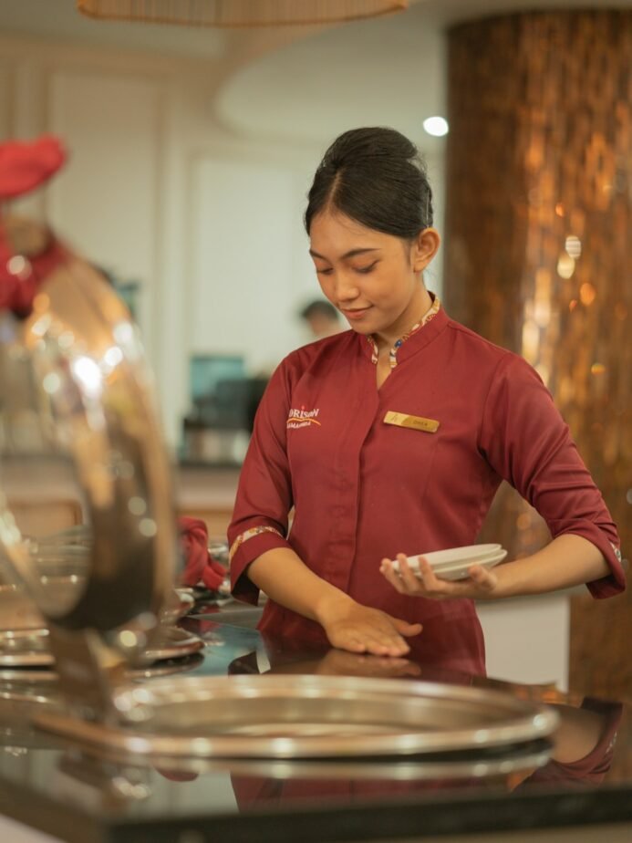 Hospitality worker providing restaurant service