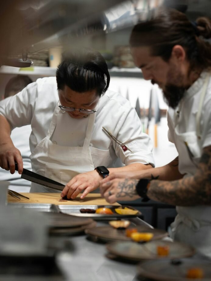 Hotel Apprenticeship in India 2026: NAPS vs NATS Guide 1 Two chefs preparing food during culinary training