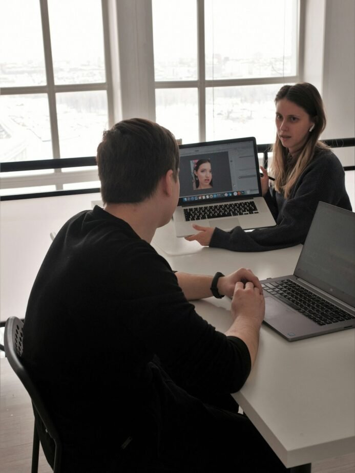 Hotel Talent Acquisition Executive Job Description: Free Template, Duties & Hiring Test 1 Colleagues discussing an application during an interview