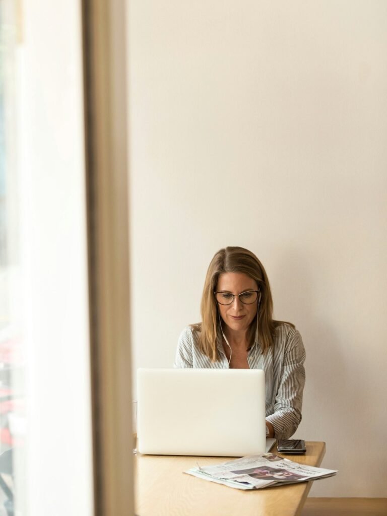 Professional checking application paperwork at a desk