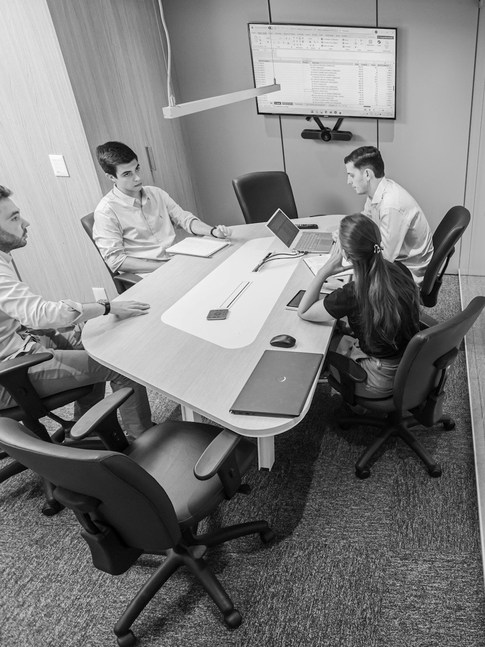Team meeting discussing training and career growth