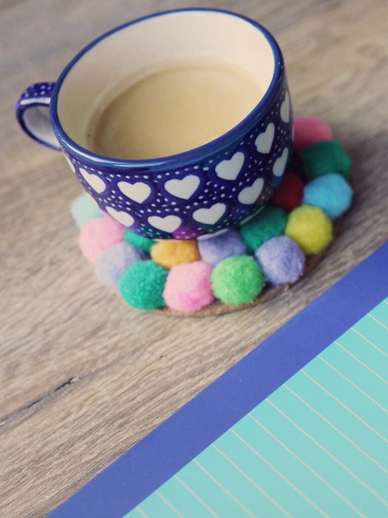 Notebook with notes next to a cup of coffee