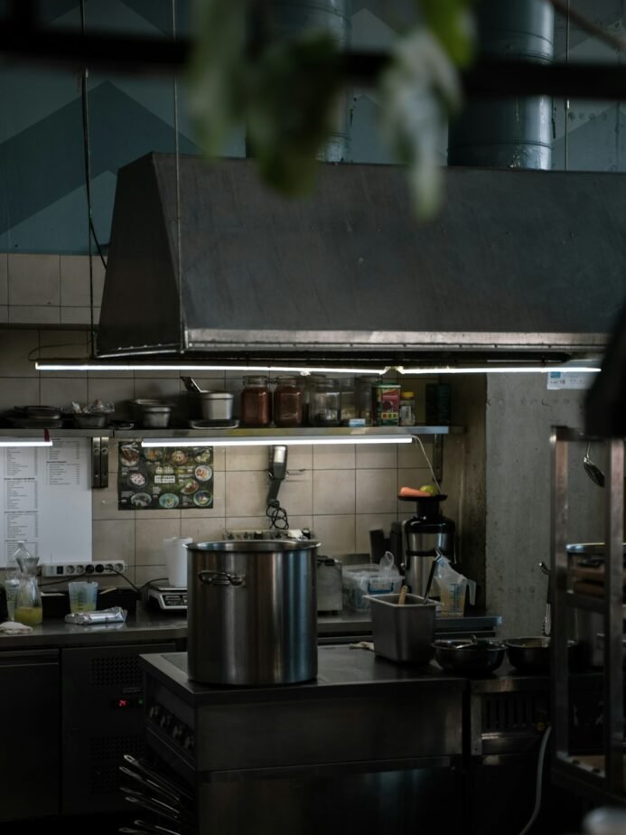 How to Hire a Cloud Kitchen Chef in India: Skills, Trial & Checklist 1 Large cooking pot on restaurant kitchen stove