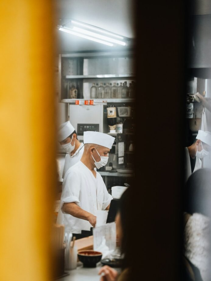 Chef Recruitment Agency in India: Fees, Process & Alternatives 1 Chefs preparing food together in a professional kitchen