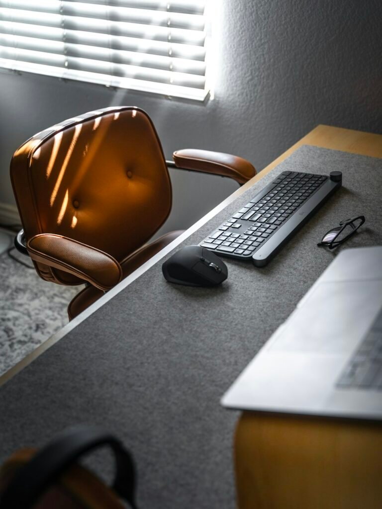 Minimal desk with laptop and chair