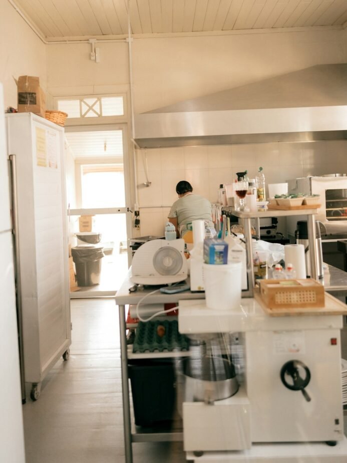 Worker at a professional commercial kitchen station