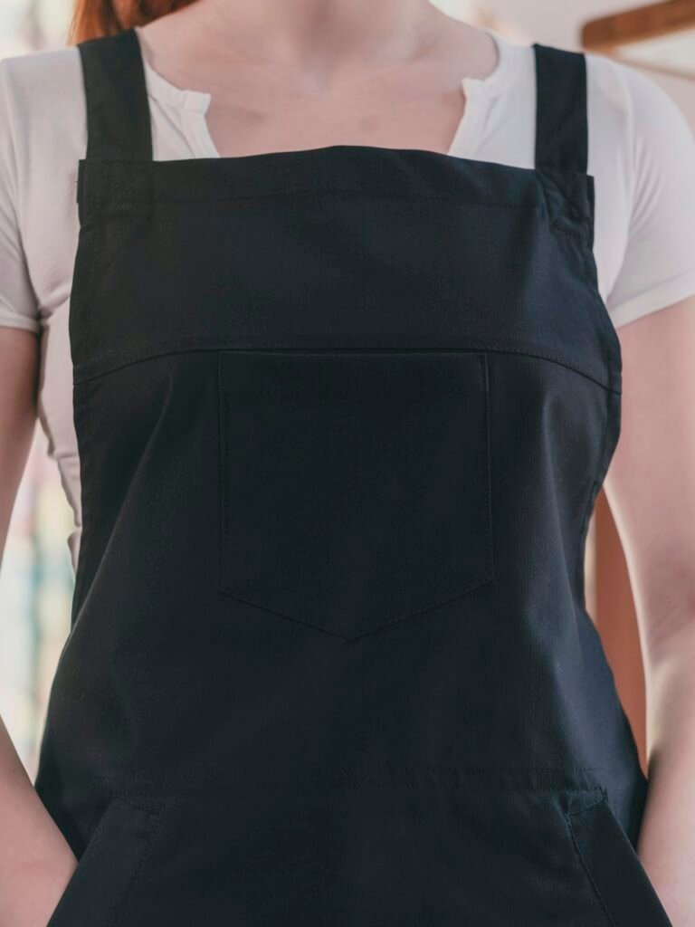 Hospitality staff member wearing a practical apron